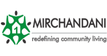 The Mirchandani Group logo. On the left, there is a stylized green pentagon shape with rounded corners. Inside the pentagon, there is a white house icon with a green number 