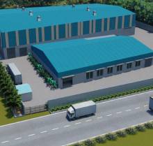 Aerial rendering of an shed, featuring two large sheds with blue roofs and light-colored walls. The facility includes loading areas, some storage containers, greenery along the perimeter, and is situated next to a road with trucks. The scene is depicted under a clear sky.
